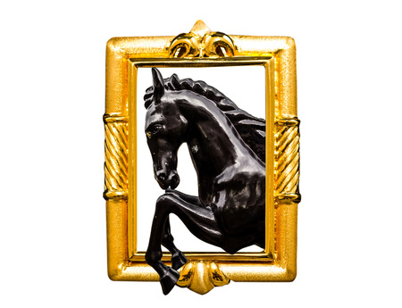 black horse sculpture in golden frameの写真素材