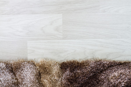 fur carpet and wooden floorの写真素材