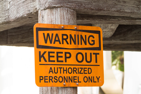 yellow warning sign for authorized personnel onlyの写真素材
