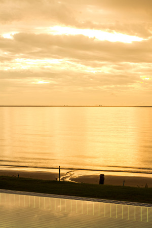 sunrise with nice orange sky at sea の写真素材