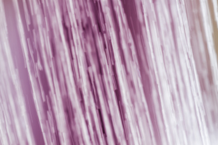 water flow from shower for refreshing in pink toneの写真素材