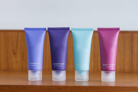 colorful tubes of bathroom amenity contains of shampoo, conditioner, shower gel, body lotionの写真素材