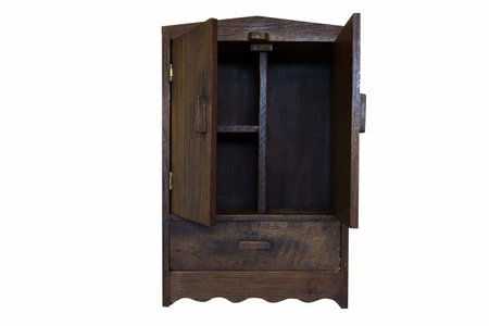 ancient design wood cupboard isolated on white background, open doorsの写真素材
