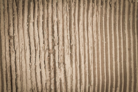 rough design brown cement wall backgroundの写真素材