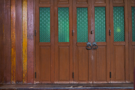 retro wood door decorate with green glassの写真素材