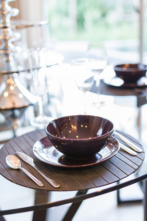 dining tableware setup on glass tableの写真素材