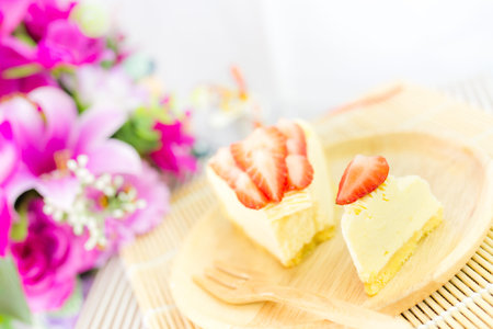 piece of strawberry tart on wood dishの写真素材