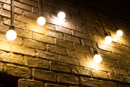 light bulb decorated on brick wallの写真素材