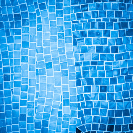 rough blue mosaic tile wall in bathroomの写真素材