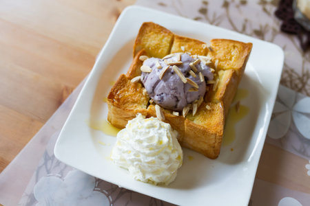 honey toast with brown rice ice-cream and whipping creamの写真素材