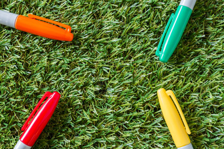 colorful cover marker pen on grass