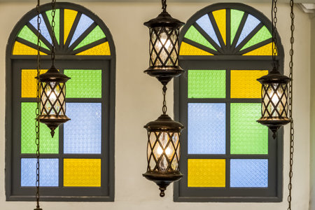vintage lamp hanging from ceiling with colorful glass window