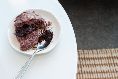 piece of riceberry bread with berry jam