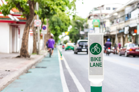 bike lane sign on road in bangkok cityの写真素材