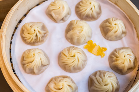 chinese style food called xiao long bao, minced pork and crab dumpling with soup insideの写真素材