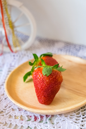 fresh strawberry on wooden dishの写真素材