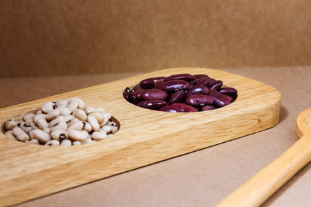 red beans and soya beans in wood trayの写真素材