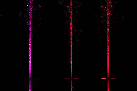 colorful water shape on fountain with black backgroundの写真素材