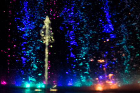 colorful water shape on fountain with black backgroundの写真素材