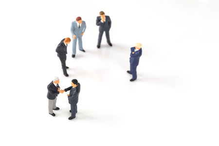 miniature group of businessmen on white backgroundの写真素材