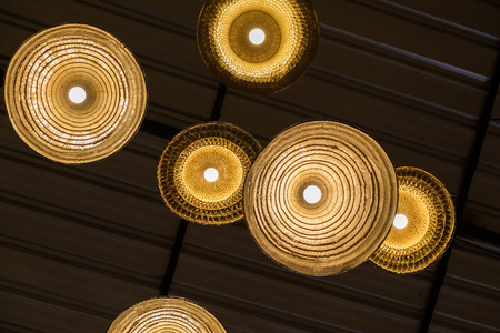 classic lamp made from farmer's bamboo hat hanging on ceilingの写真素材