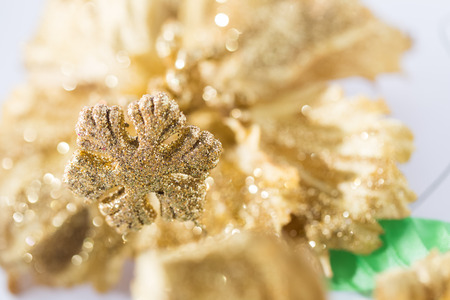 shining golden snowflake decoration with bokeh backgroundの写真素材