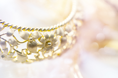 colorful soft blur gold bracelet with ancient design for backgroundの写真素材