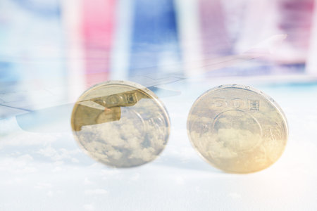 Taiwanese money with plane wing on background, double exposure