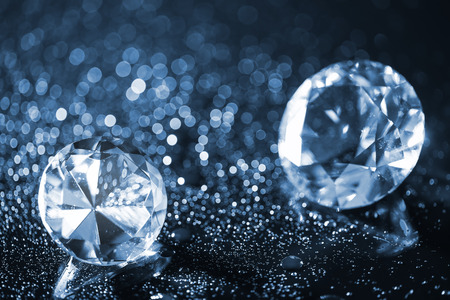 colorful round diamond on shiny bokeh backgroundの写真素材