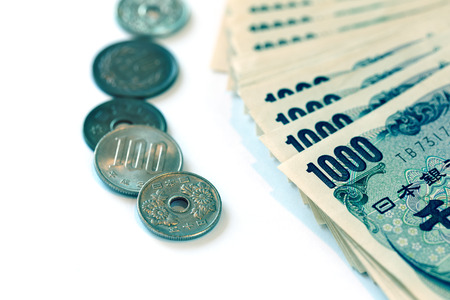 japanese coins and banknotes on white background in blue toneの写真素材