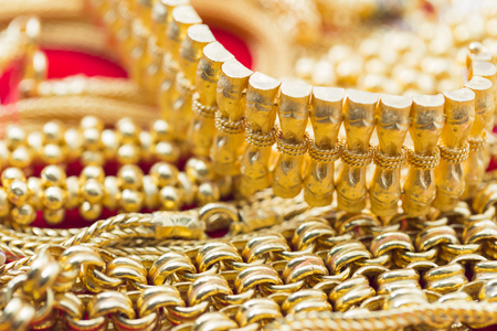 closeup group of gold necklaces and braceletsの写真素材