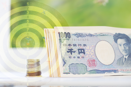 japanese money double exposure with dartboardの写真素材