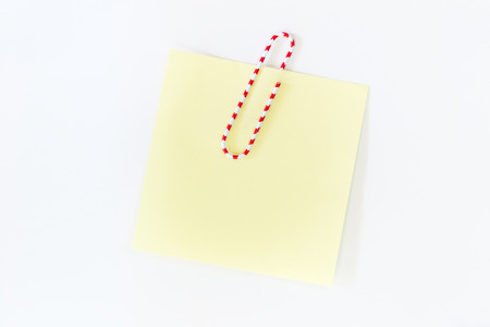 colorful paper clips spread on white backgroundの写真素材