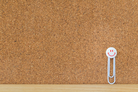 smile face clip on cork boardの写真素材