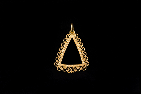 triangle shape gold locket frame pendant on black backgroundの写真素材