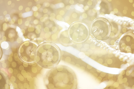 abstract golden bells with bokeh backgroundの写真素材