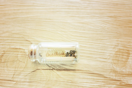 concept of blessing for goodluck, wood carved goodluck word in glass bottle