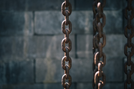chains decorated with black brick backgroundの写真素材