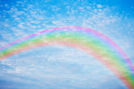 texture of cloudy with rainbow on blue skyの写真素材