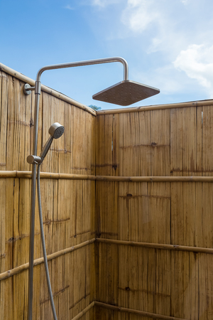 closeup outdoor shower with bamboo wallの写真素材
