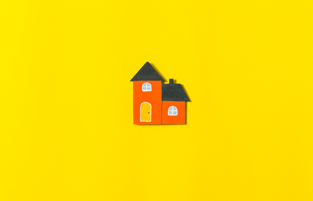 colorful home model on yellow background, concepts for real estate and businessの写真素材
