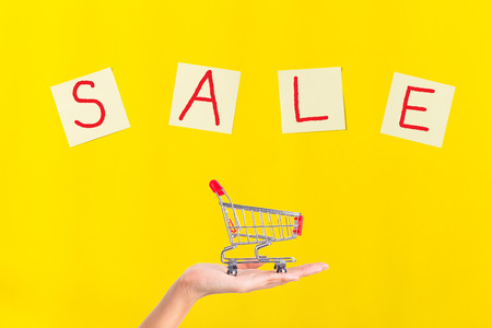 flat lay note papers on yellow background with copy space, office and education conceptの写真素材