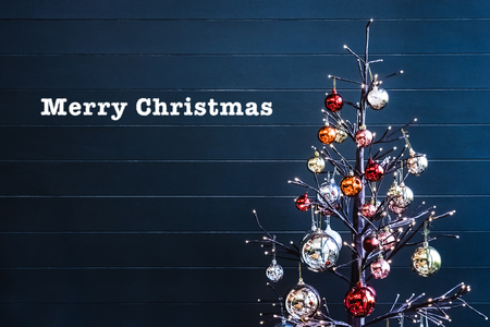 christmas tree decoration with merry christmas word on dark blue backgroundの写真素材
