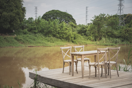set of wood table and chairs at pier, relaxation conceptの写真素材