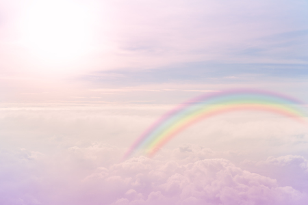 rainbow on pastel sky with texture of cloudの写真素材