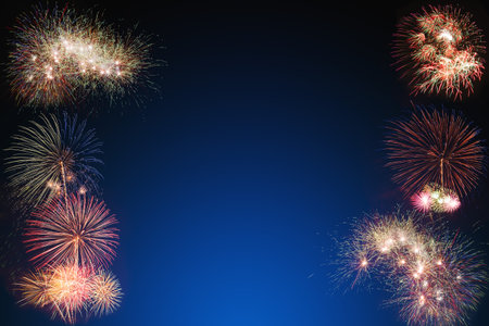 colorful fireworks on dark blue background, celebration and party concept