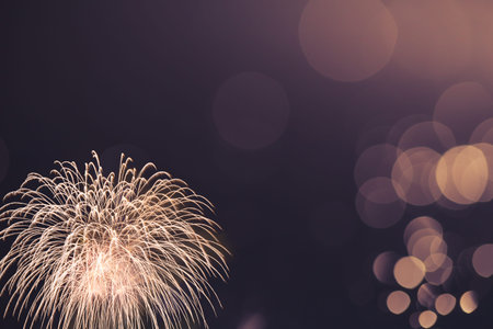 colorful fireworks with vintage tone bokeh background, celebration concept