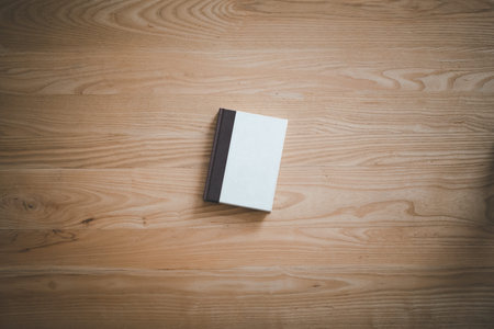 top view book on light brown wooden tableの写真素材