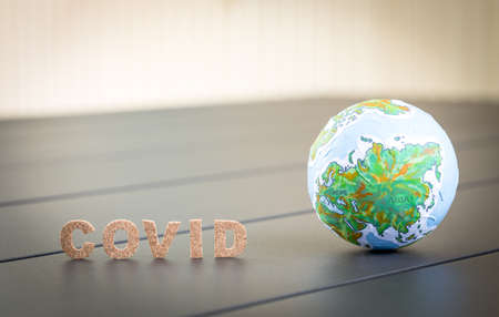 covid word and globe ball, coronavirus concept backgroundの写真素材
