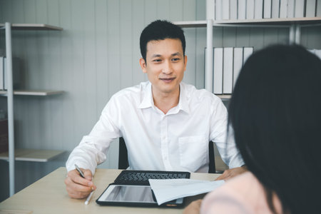 back of woman making an job interview to HR manager in office, staff hiring process